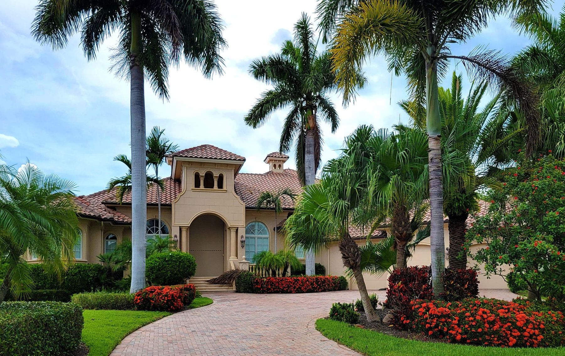 Estate with palm-lined entry drive