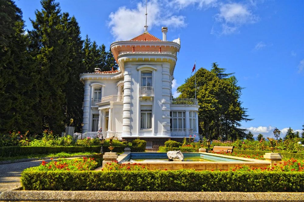 White villa with formal fountain garden